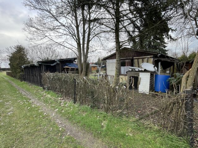 Grundstück kaufen in Mit Gartenhaus und Schuppen bebaute